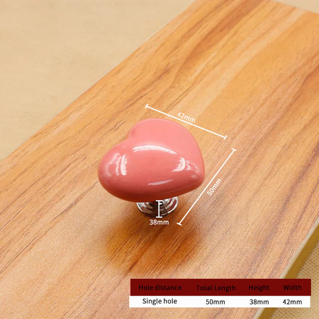 Pomo / tirador cerámico. Modelo: Corazón palo rosa
